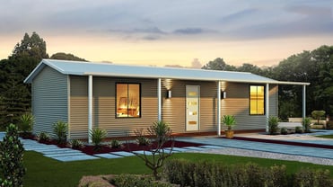 Charming small house with covered porch and landscaping, ideal for rural living.