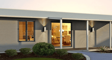 A modular home with a porch and a porch light, showcasing small house design.