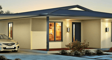 A modular home with a car parked outside, showcasing innovative designs for compact living.